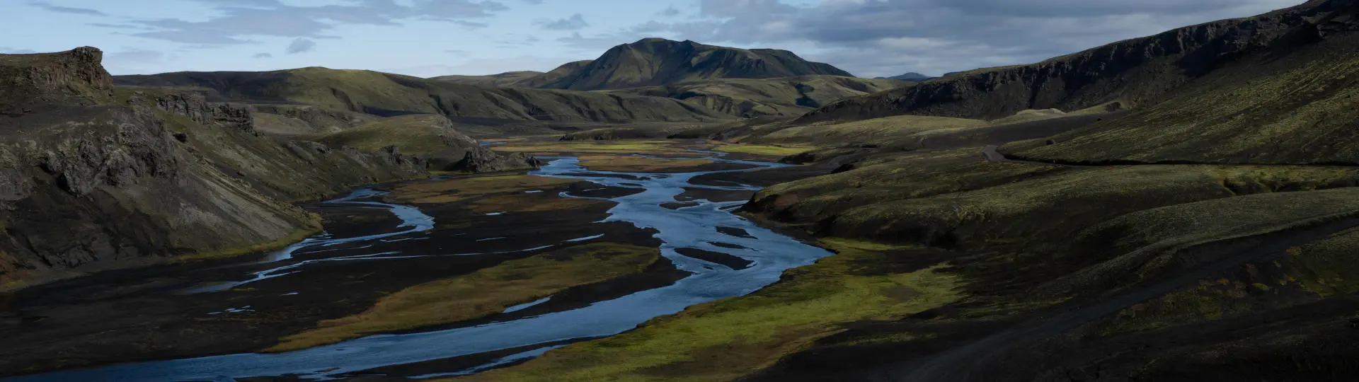 Mounatins and blue braided river